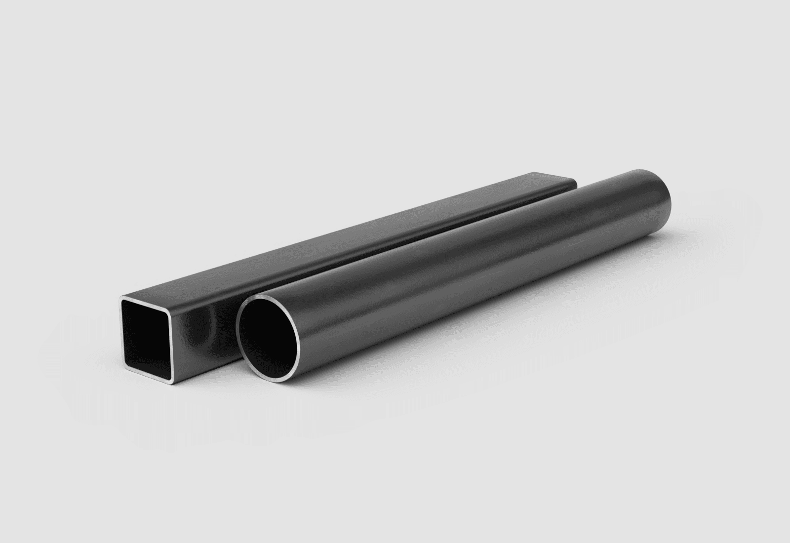 Square steel HSS tube and round steel pipe lying side by side